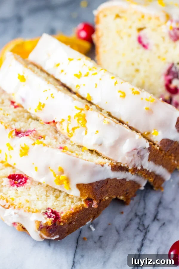 Cranberry Orange Loaf Cake Recipe with Zesty Glaze 4 Glazed Cranberry Orange Loaf. Super soft & moist because it's made with sour cream - be sure to include this recipe in your holiday baking check list! www.justsotasty.com