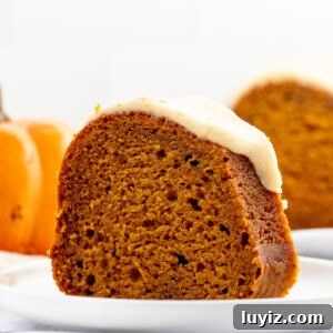 Moist Pumpkin Bundt Cake with Warm Spice Glaze 10 Slice of pumpkin bundt cake with maple glaze