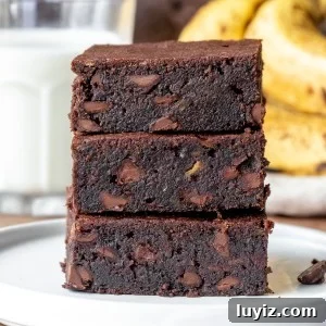Super Moist Banana Brownies Recipe for Ultra-Fudgy Results 9 Stack of 3 moist brownies placed one on top of each other