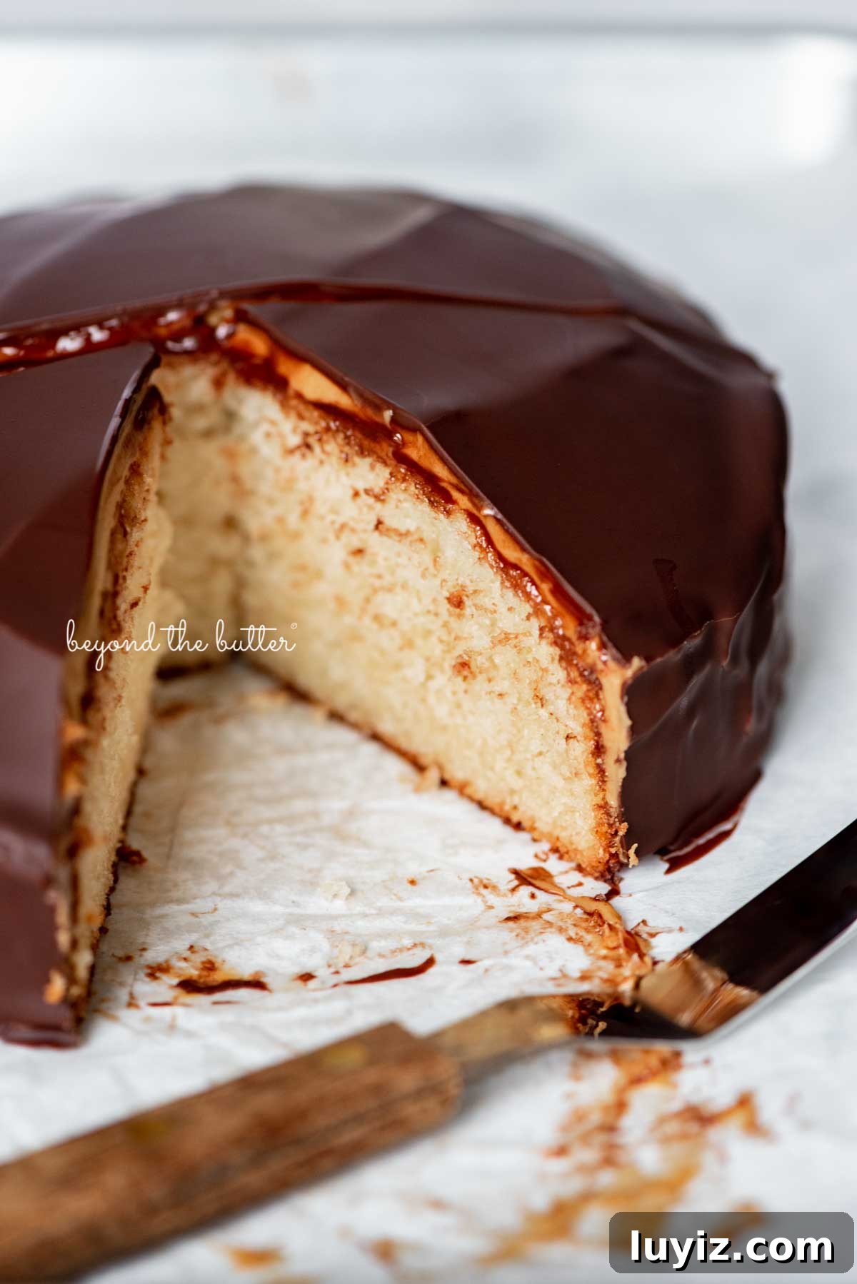 Mini Chocolate Peanut Butter Tandy Cake Recipe 9 Sliced chocolate peanut butter tandy kake on a parchment paper lined baking sheet | © Beyond the Butter®