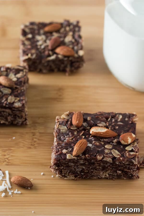 Almond Joy Granola Bars Recipe — Coconut, Almond & Chocolate Bars 2 Almonds, coconut & chocolate come together in these delicious Almond Joy Granola Bars. Wholesome ingredients, gluten-free, vegan, super easy and totally addictive! www.justsotasty.com