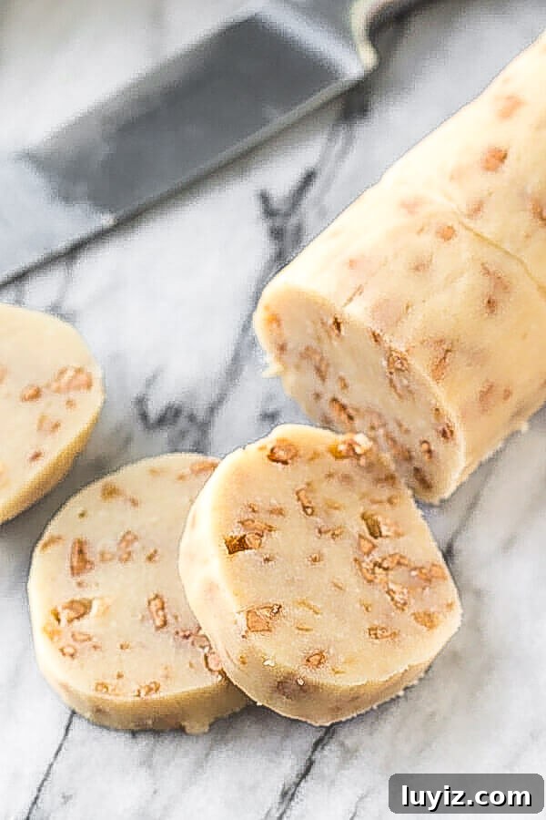 Freeze Cookie Dough and Baked Cookies: Simple Steps for Fresh Results 5 A log of slice and bake cookie dough with 3 cookies sliced.