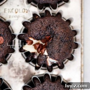 Mini Black-Bottom Chocolate Cupcakes (Small Batch Recipe) 8 Vintage baking tin filled with small batch black bottom cucpakes.