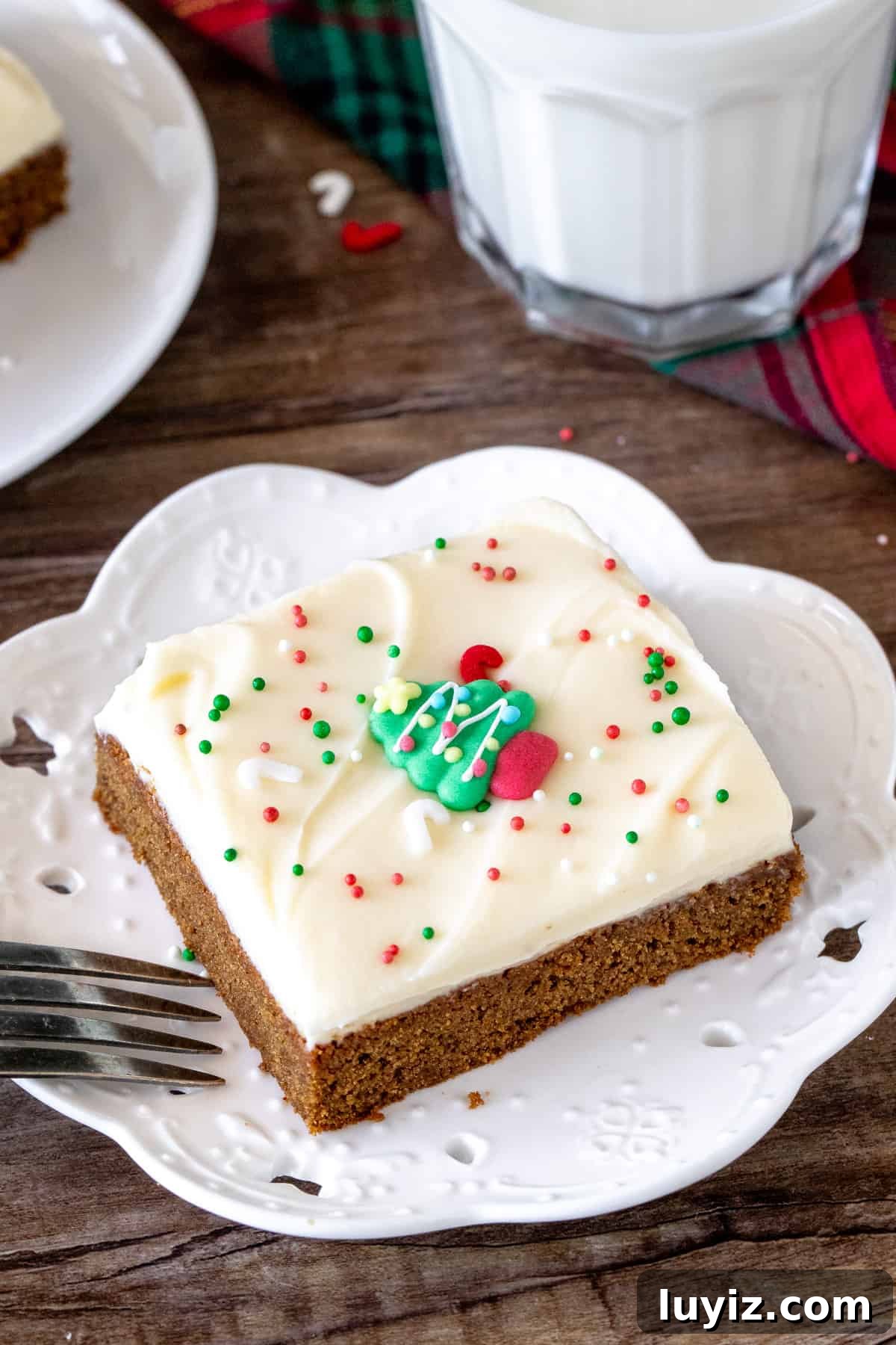 Chewy Gingerbread Cookie Bars with Spiced Molasses Glaze 5 Slice of gingerbread bar with frosting
