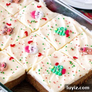 Chewy Gingerbread Cookie Bars with Spiced Molasses Glaze 6 9x13 inch pan of gingerbread cookie bars cut into squares.