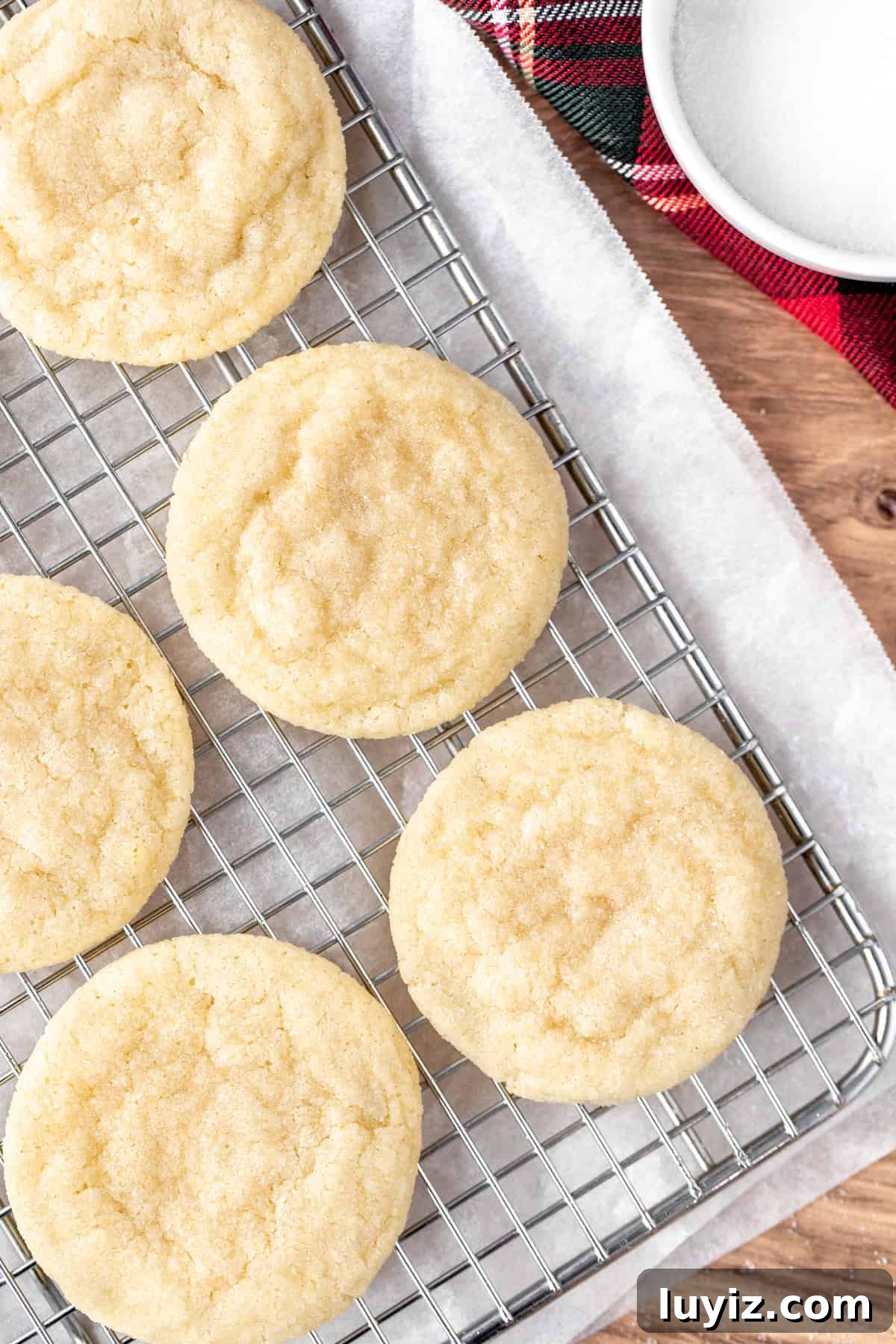 Chewy Sugar Cookies Recipe for Soft, Melt-in-Your-Mouth Cookies 4 Chewy sugar cookies on a cooling rack