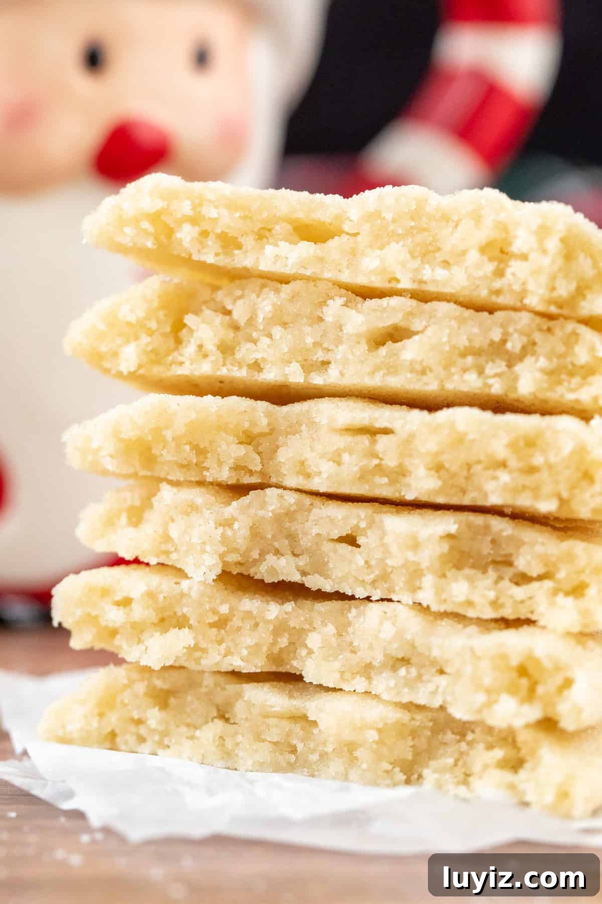 Chewy Sugar Cookies Recipe for Soft, Melt-in-Your-Mouth Cookies 8 Stack of chewy sugar cookies, broken in half
