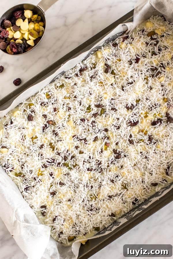 Christmas Magic Cookie Bar Recipe for Holiday Parties 3 Christmas magic cookie bars in their pan before going into the oven.