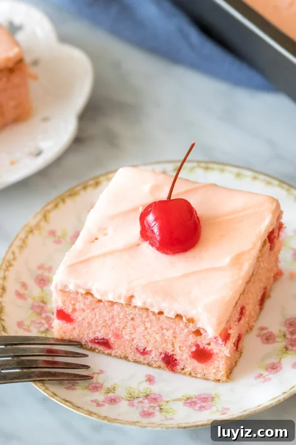 Moist Maraschino Cherry Cake Recipe with Cherry Glaze 3 Slice of cherry cake with cherry frosting and a cherry on top.