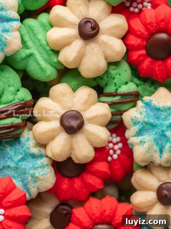 Chocolate Thumbprint Cookies with Raspberry Jam Filling 7 Pile of decorated buttery classic spritz cookies.