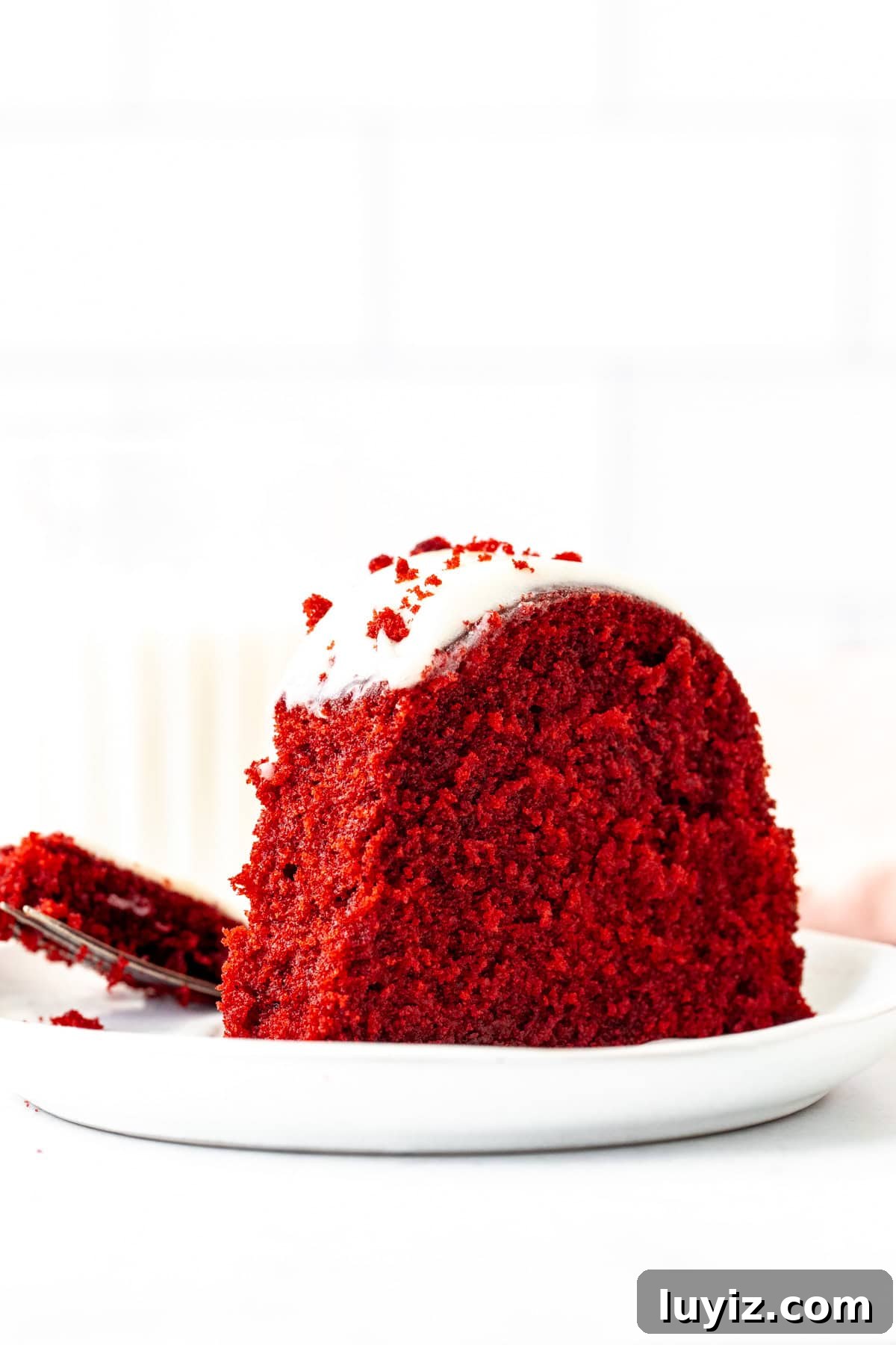 Moist Red Velvet Bundt Cake Recipe with Cream Cheese Glaze 11 Piece of red velvet bundt cake with a bite taken out