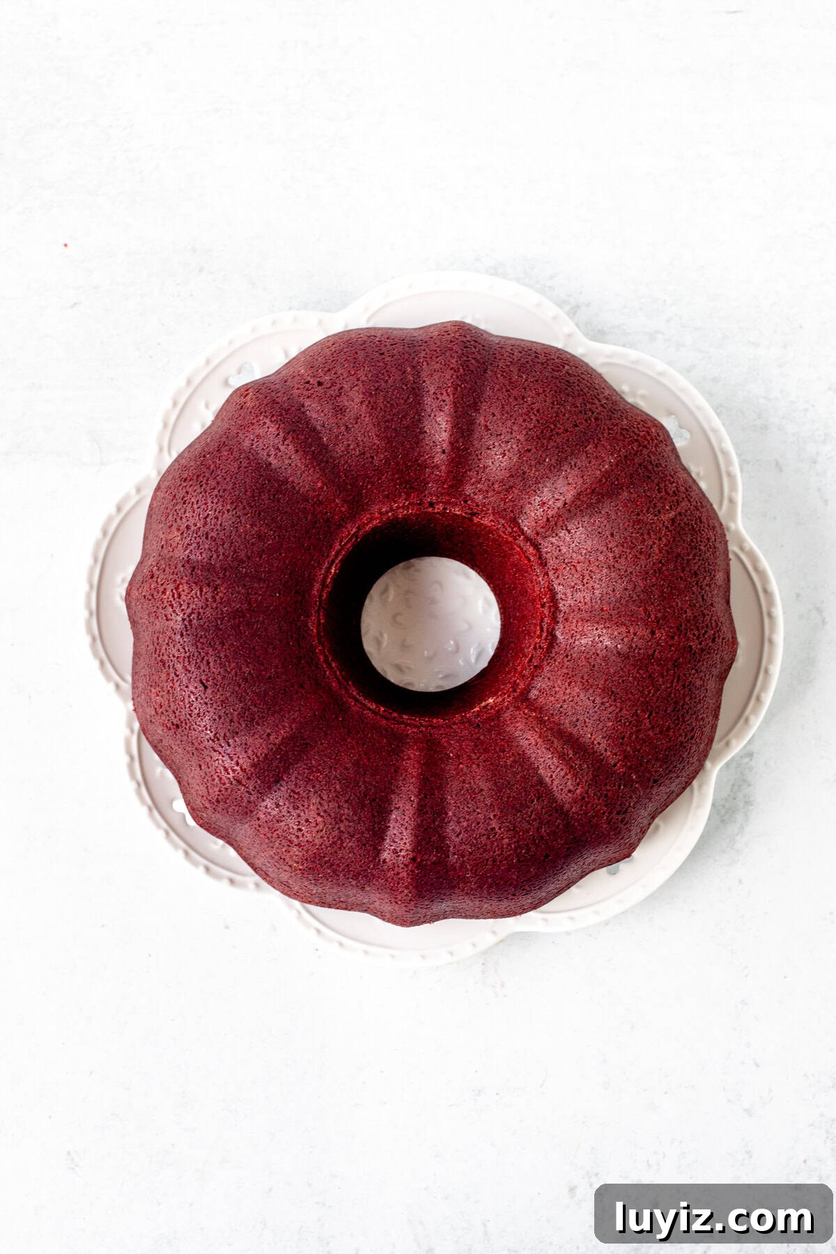 Moist Red Velvet Bundt Cake Recipe with Cream Cheese Glaze 8 Red velvet bundt cake on a plate