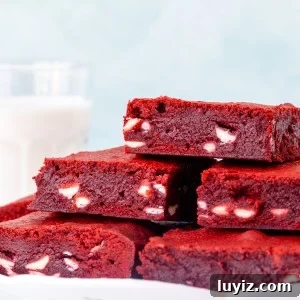 Plate of red velvet brownies filled with white chocolate chips