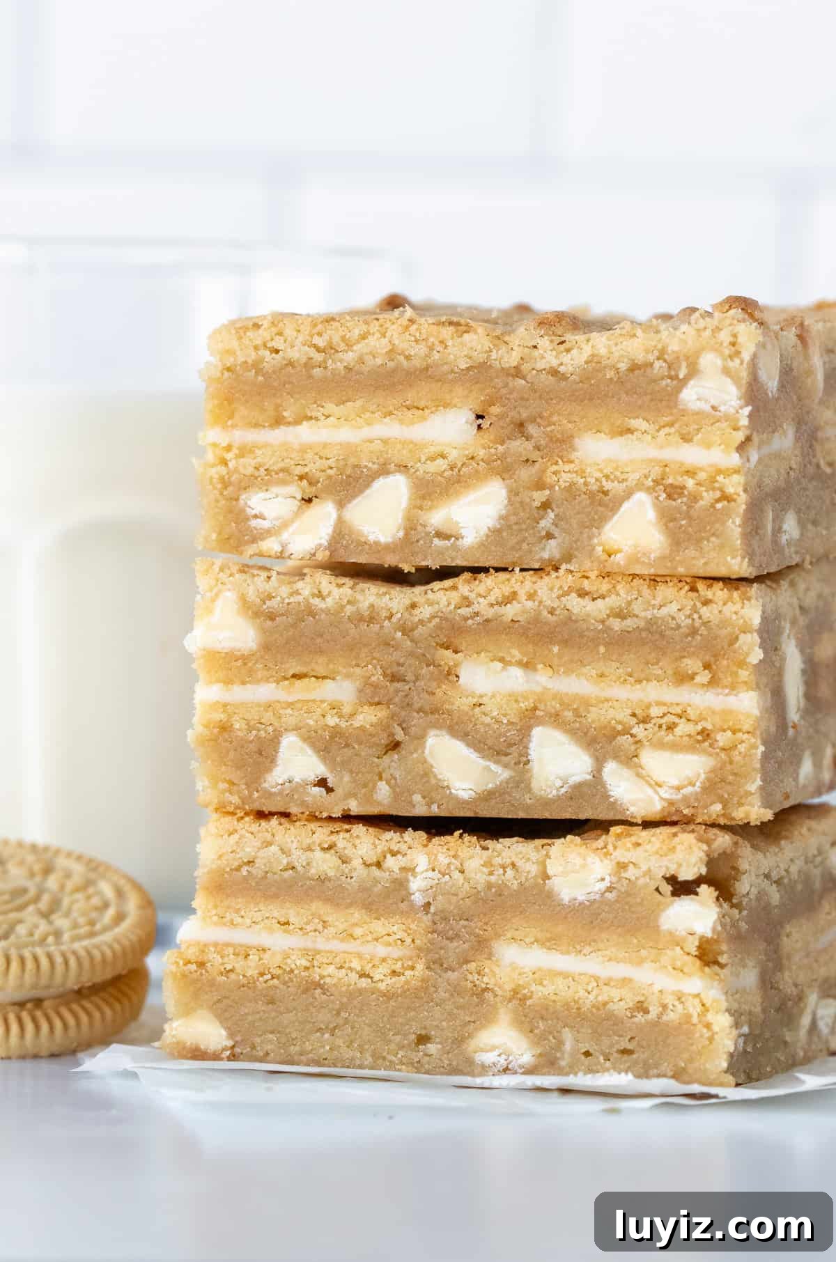 Chewy Golden Oreo Blondies Recipe for Dessert Lovers 4 Three blondies stuffed with Golden Oreos, one on top of the other