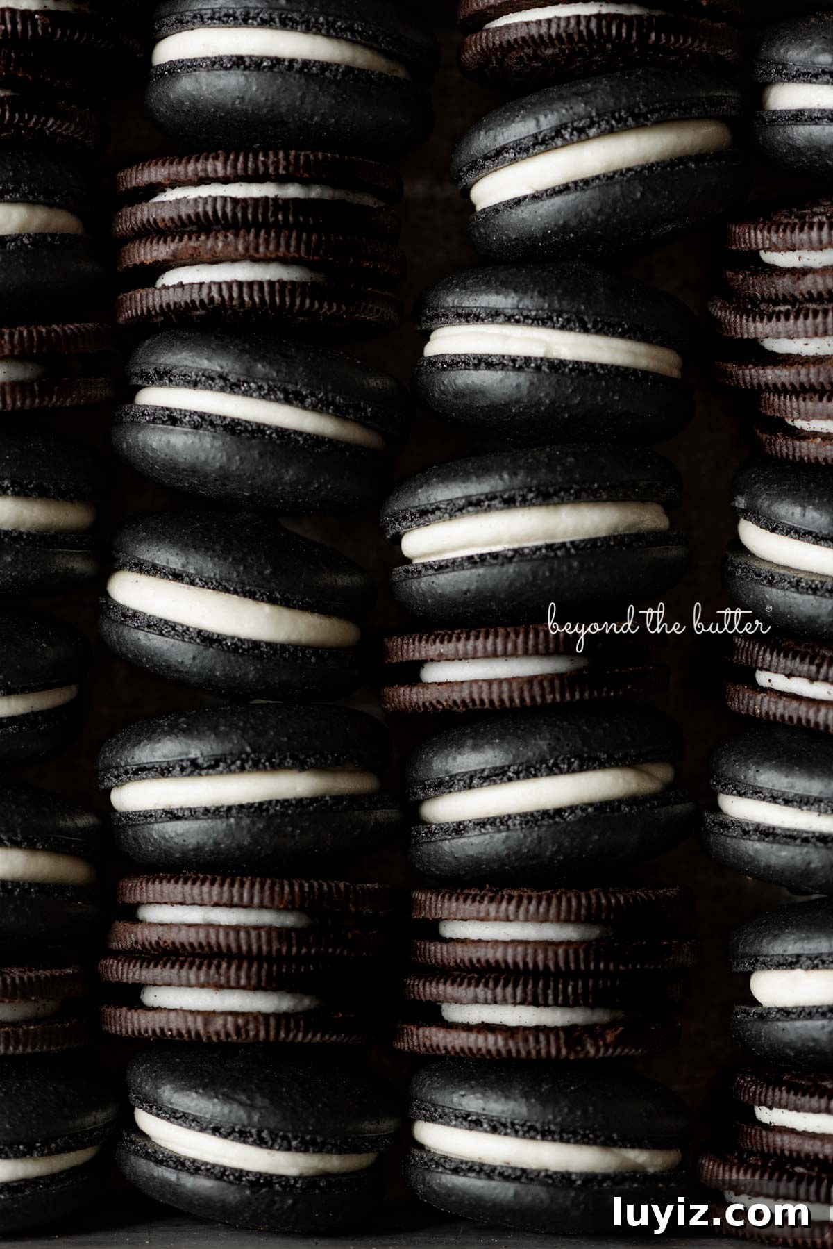 Oreo Cookie Macarons: Step-by-Step Recipe for Perfect Bites 7 Stacked oreo macarons mixed with oreo cookies in a vintage baking tin