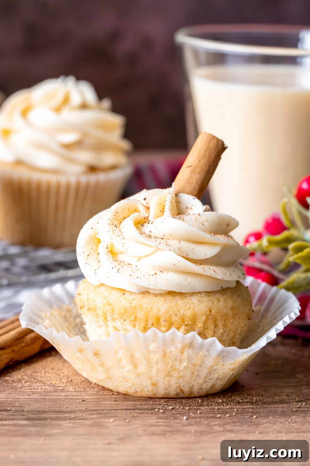 Decadent Eggnog Cupcakes with Spiced Buttercream Frosting 4 Frosted cupcake with cupcake peeled back