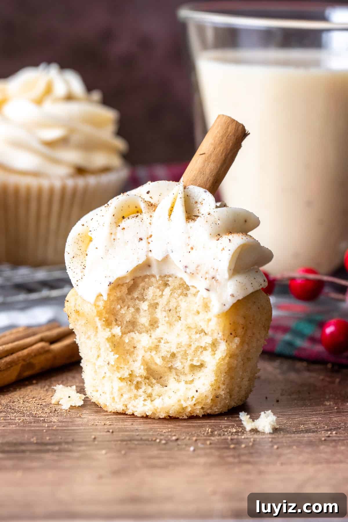 Decadent Eggnog Cupcakes with Spiced Buttercream Frosting 5 Eggnog cupcake with a bite taken out