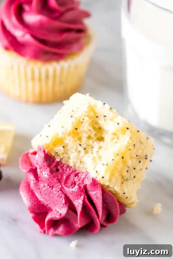 Cupcake on its side with a bite taken out of it.