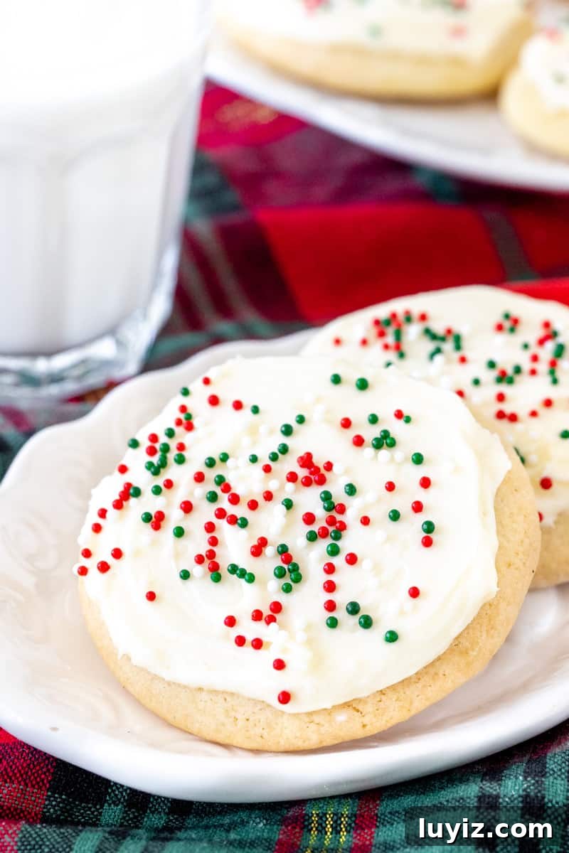 Soft-Batch Sour Cream Sugar Cookies — Ultra-Soft, Tender Cookies 5 2 Christmas sugar cookies with a glass of milk