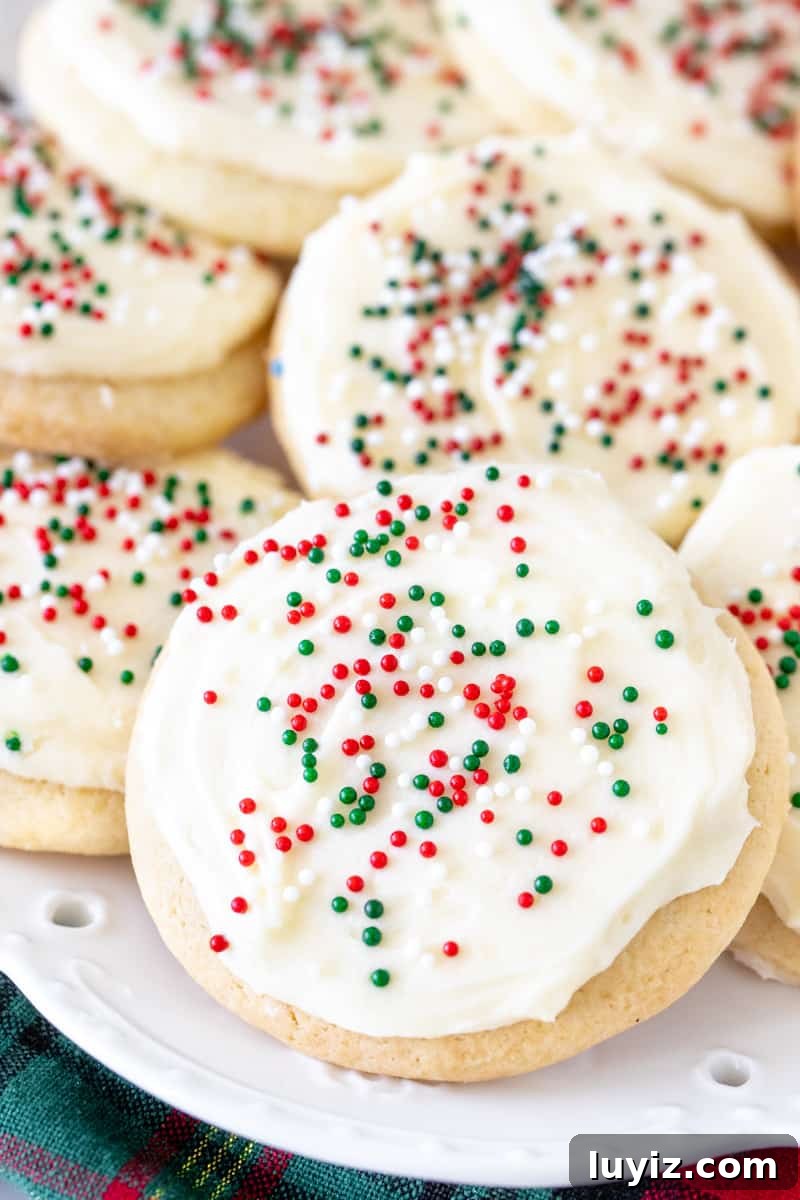 Soft-Batch Sour Cream Sugar Cookies — Ultra-Soft, Tender Cookies 6 Plate of thick, soft, sour cream sugar cookies with frosting and sprinkles