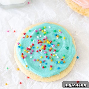 Soft-Batch Sour Cream Sugar Cookies — Ultra-Soft, Tender Cookies 7 Sour cream sugar cookie with blue frosting and sprinkles