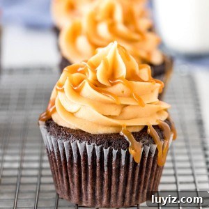 Silky Caramel Frosting Recipe for Cakes and Cupcakes 5 Chocolate cupcakes with caramel frosting and caramel sauce.