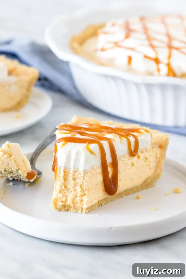 Decadent Caramel Cream Pie Recipe: Silky, No-Bake Dessert 4 Slice of caramel cream pie with a bite taken out of it on a plate.