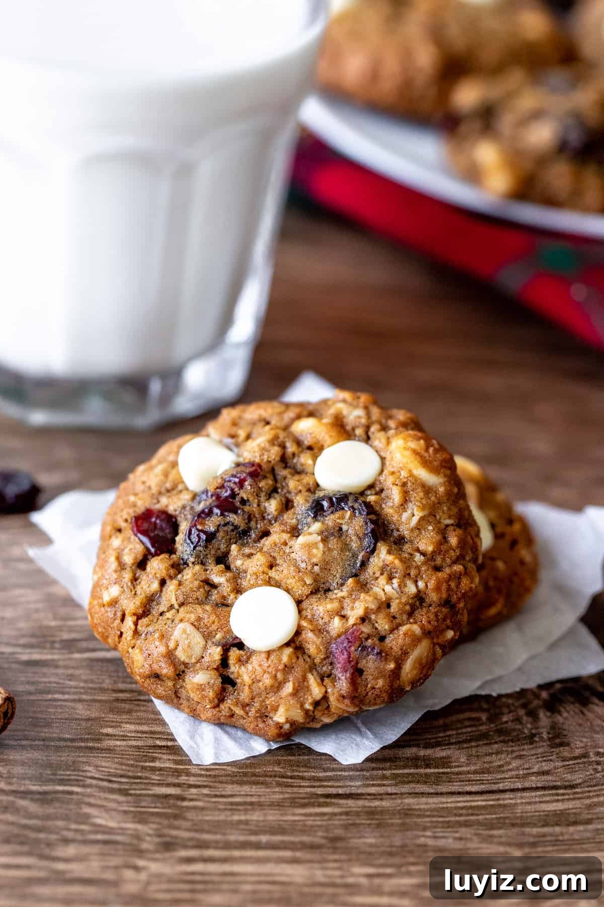 White Chocolate Cranberry Oatmeal Cookie Recipe for Chewy Bliss 2 White chocolate cranberry oatmeal cookies with glass of milk