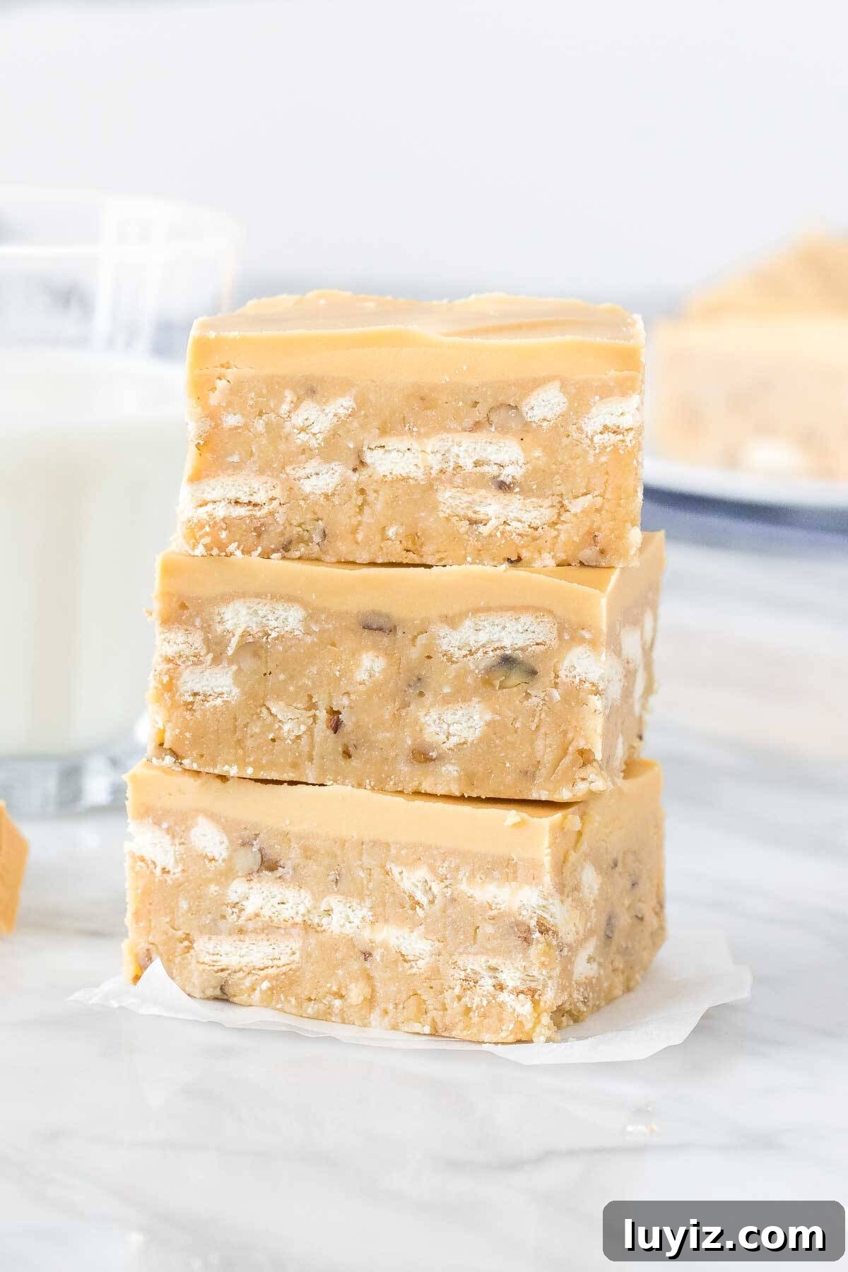 Caramilk Slice Recipe: Creamy No-Bake Caramel Chocolate Bars 2 Stack of 3 Caramilk slices with a glass of milk.