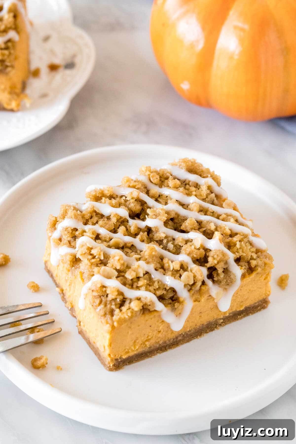 Pumpkin Streusel Bars Recipe — Perfect Fall Dessert Bars 3 Pumpkin bar with oatmeal topping and a drizzle of vanilla glaze.