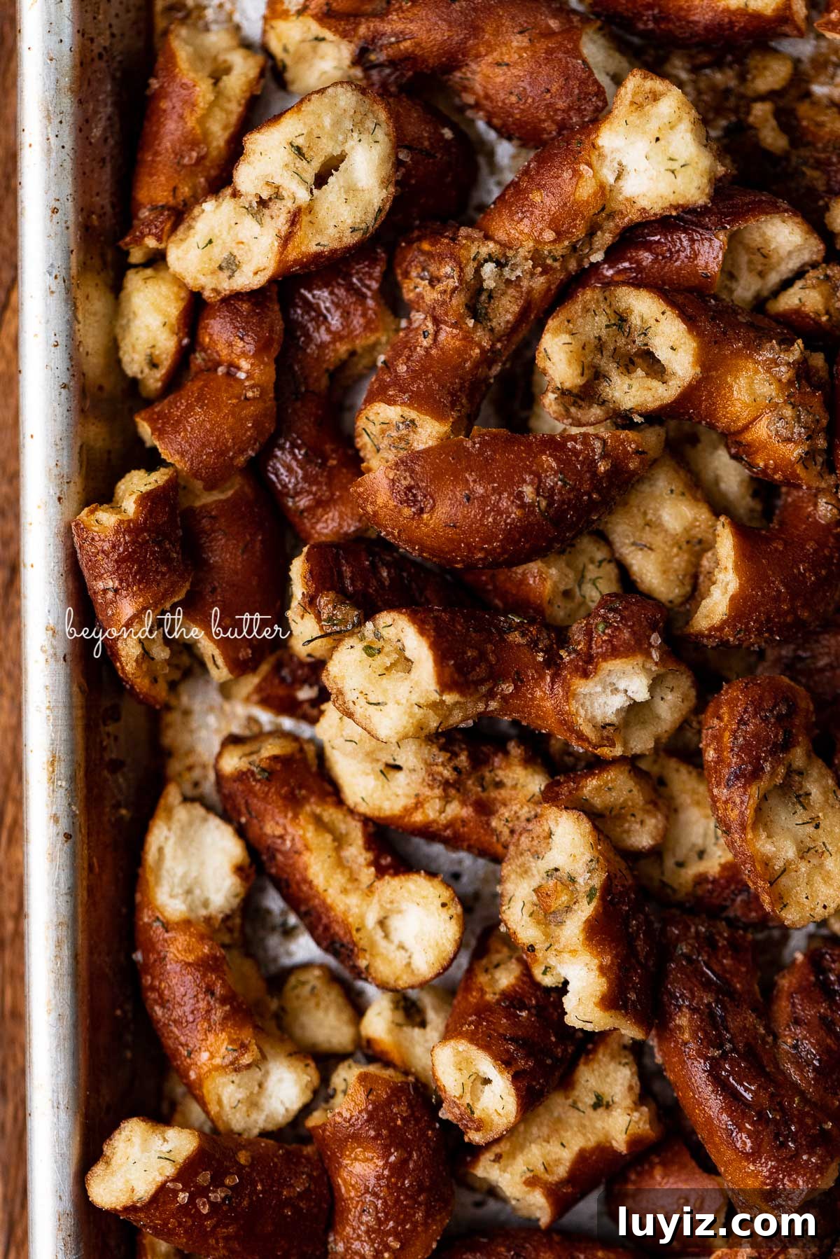Savory Seasoned Pretzels: Flavorful Homemade Snack Recipe 7 Baking sheet with just baked seasoned pretzels | © Beyond the Butter®