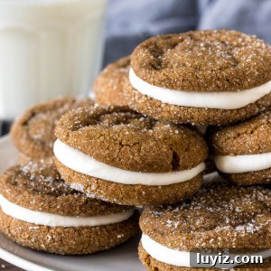 Plate of molasses sandwich cookies with marshmallow frosting.