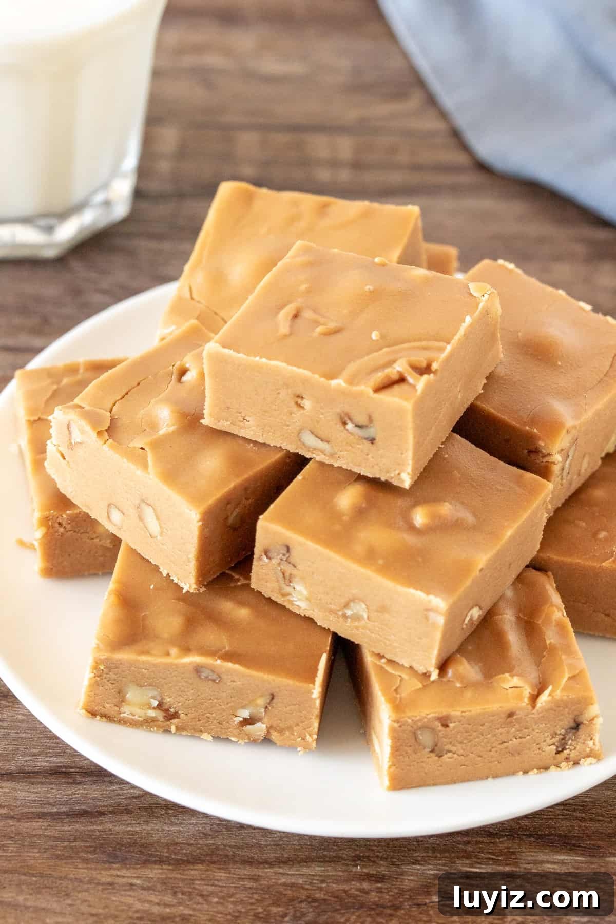 Irresistible Brown Sugar Fudge Recipe: Soft, Chewy Squares 2 Plate of brown sugar fudge with a glass of milk.