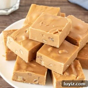 Plate of brown sugar fudge with a glass of milk.