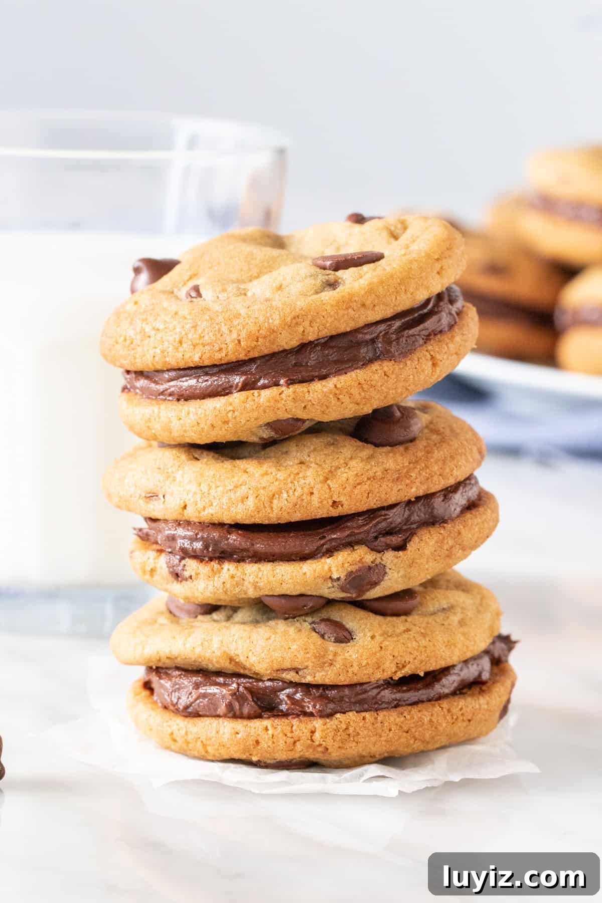 Chewy Chocolate Chip Sandwich Cookies Recipe for Homemade Treats 3 Stack of cookies with buttercream in the middle.