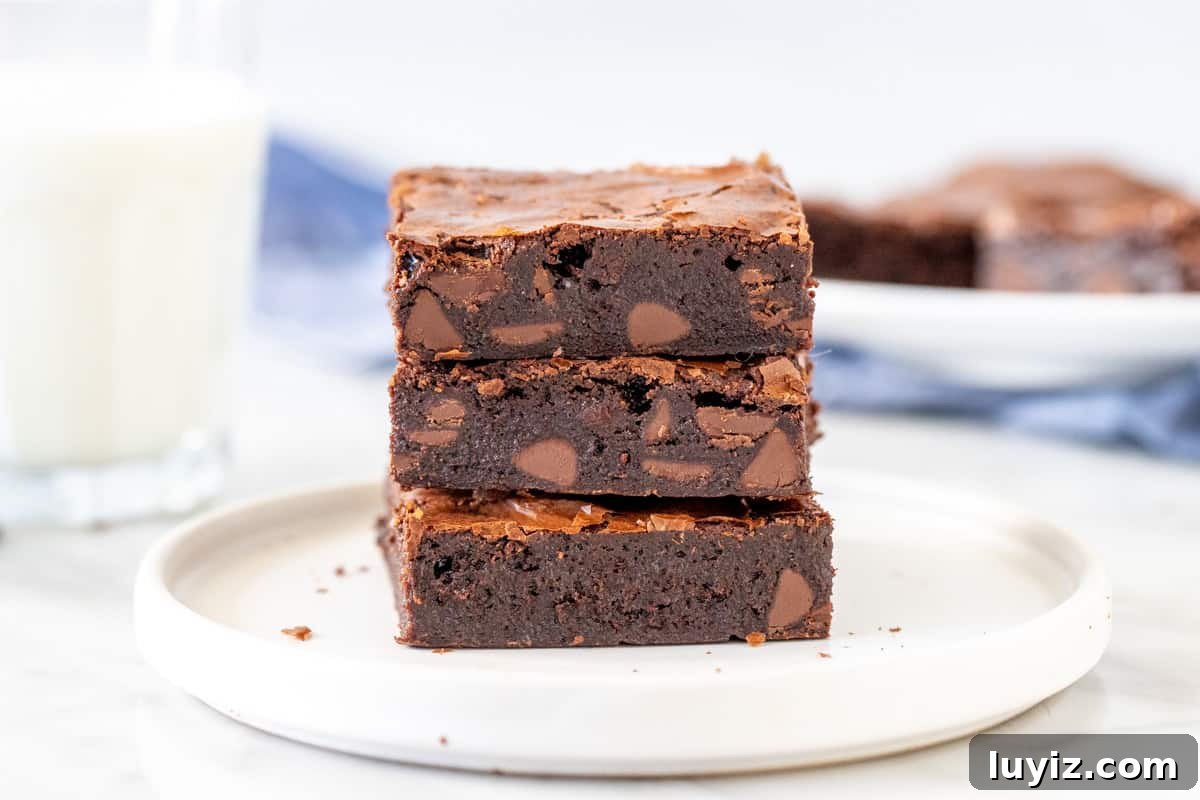 Decadent Flourless Chocolate Brownies Recipe 4 3 gluten-free brownies stacked on top of one another.