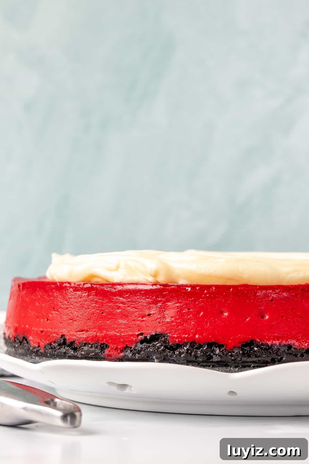 Decadent Red Velvet Cheesecake Recipe for Every Occasion 3 9-inch round red velvet cheesecake with Oreo crust and cream cheese frosting