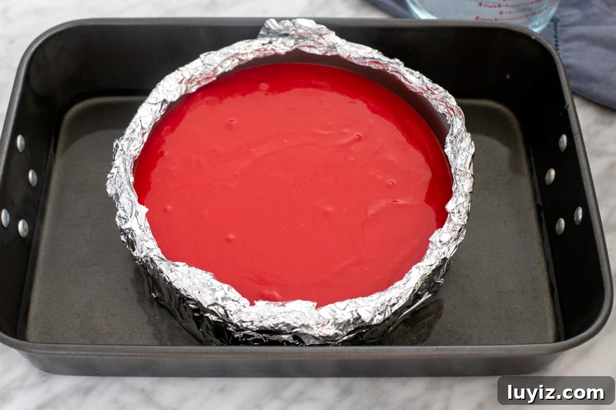 Decadent Red Velvet Cheesecake Recipe for Every Occasion 4 Unbaked cheesecake in a water bath