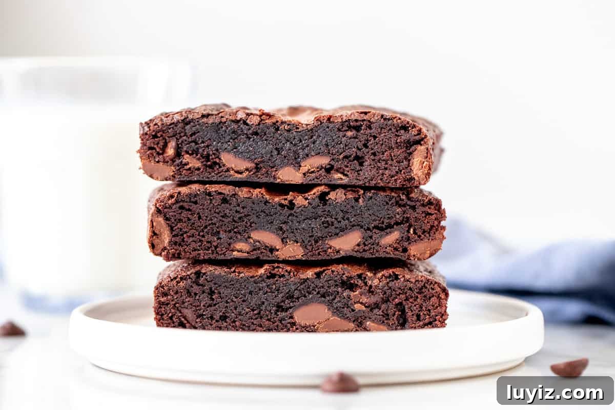Small-Batch Fudgy Brownies Recipe for Two 4 3 small-batch brownies stacked on a plate.