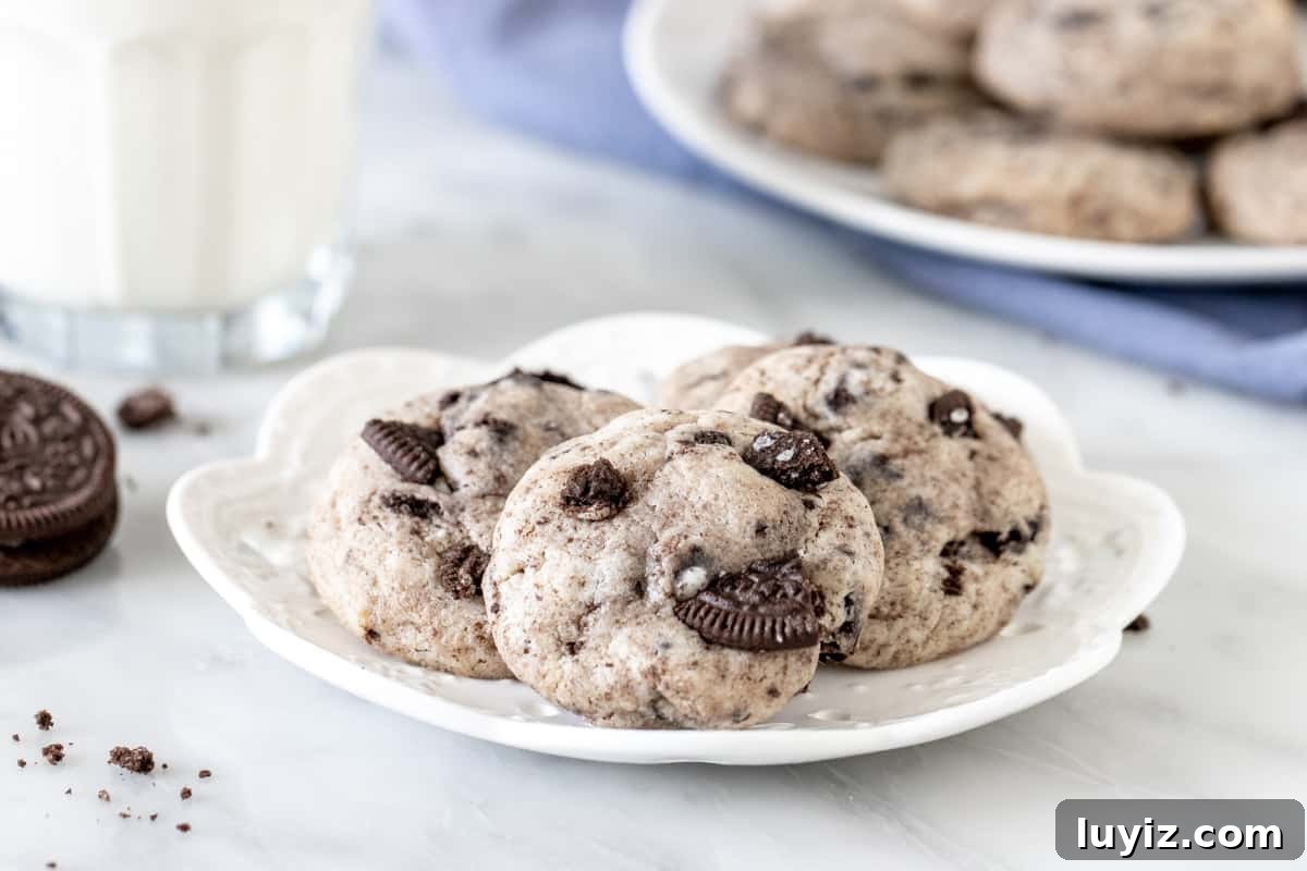 Oreo Cheesecake Stuffed Cookies: Decadent No-Bake Recipe 4 Plate of 3 cookies made with chopped Oreo cookies.