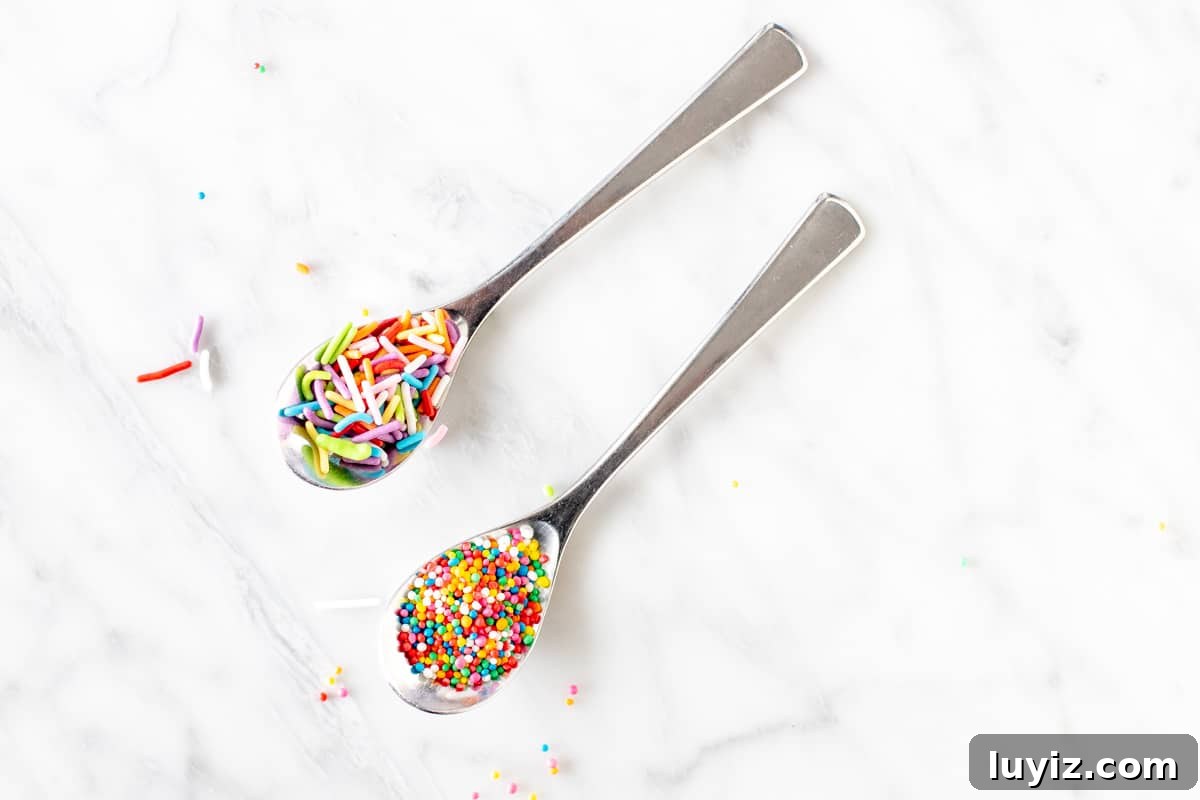 Scratch-Made Funfetti Cake Filled with Rainbow Sprinkles 4 2 spoons of sprinkles