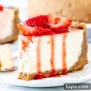 Decadent Strawberry Cheesecake Recipe with Fresh Strawberry Glaze 6 Slice of strawberry cheesecake on a plate