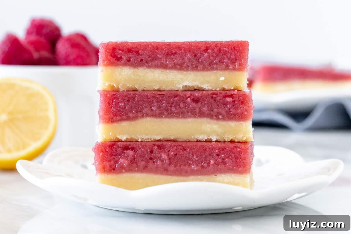 Zesty Lemon Raspberry Dessert Bars — Bright Tart Bar Recipe 7 Stack of 3 lemon raspberry bars