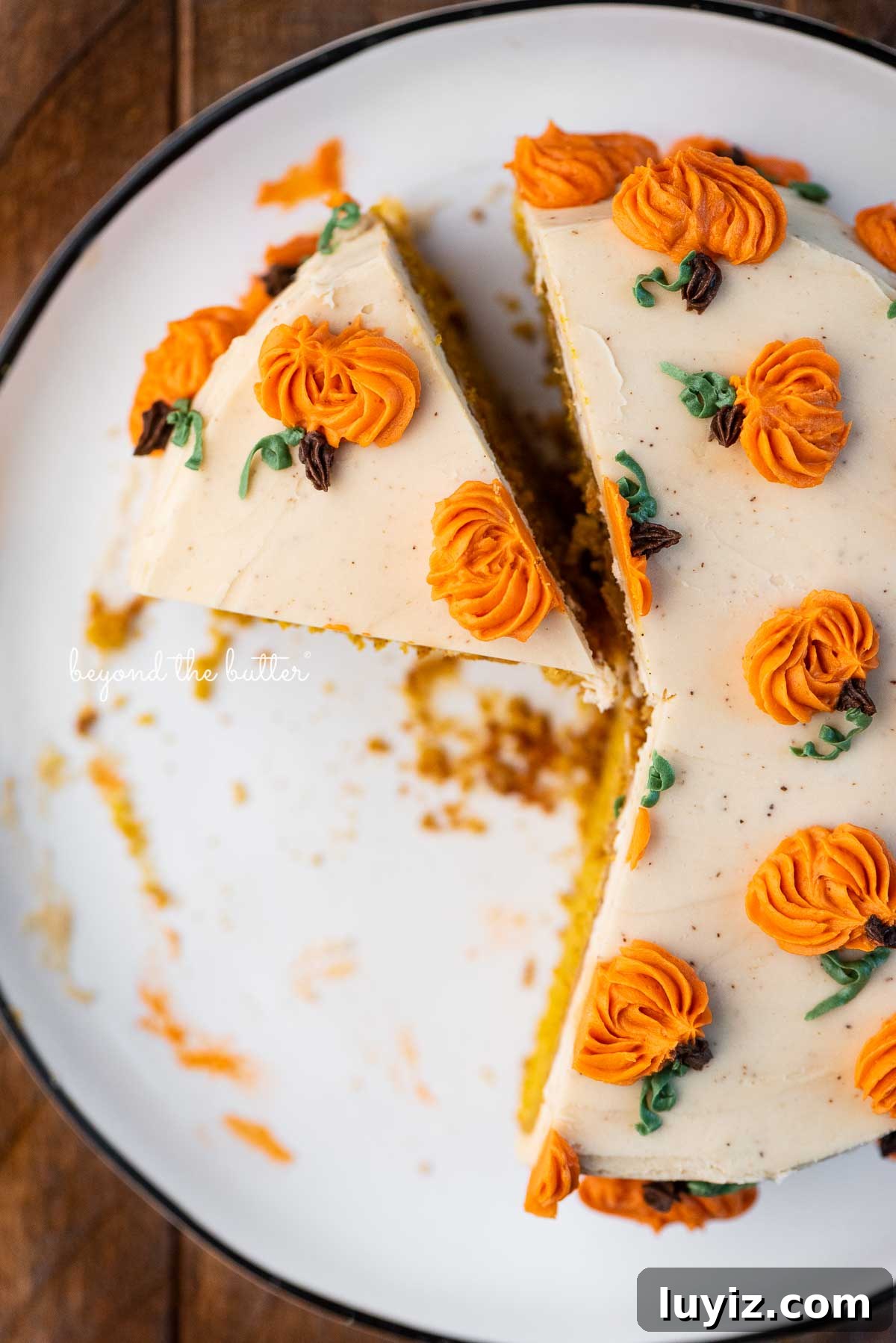 Single-Layer Pumpkin Spice Cake Recipe for Moist Fall Desserts 4 Slice of pumpkin spice cake on a black and white dessert plate | © Beyond the Butter®