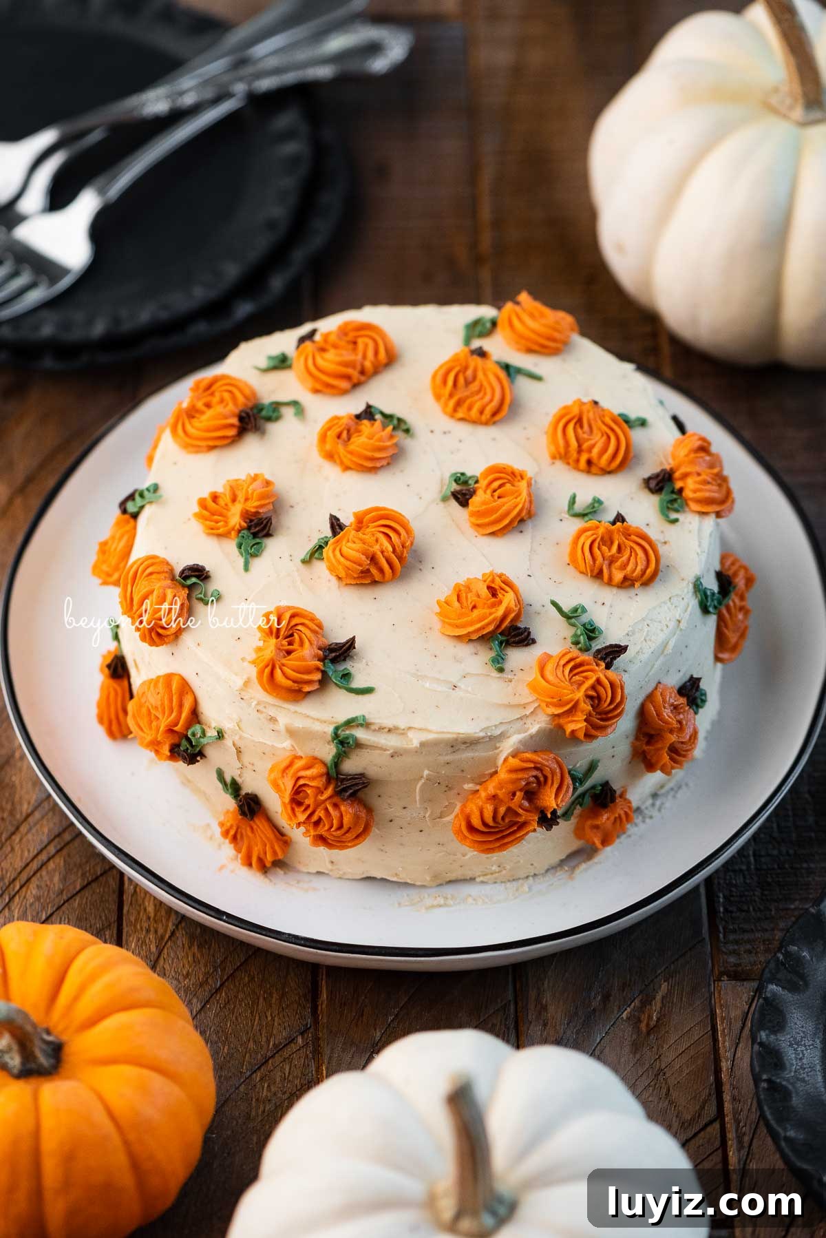 Single-Layer Pumpkin Spice Cake Recipe for Moist Fall Desserts 6 Single layer pumpkin spice cake on a black and white dessert plate | © Beyond the Butter®