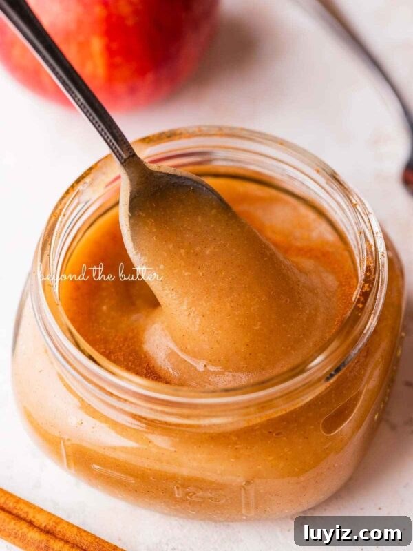 Single-Layer Pumpkin Spice Cake Recipe for Moist Fall Desserts 10 Jar of homemade applesauce with apples.