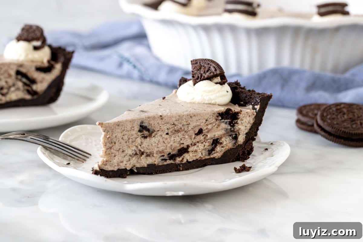 Irresistible Oreo Chocolate Pie Recipe: Creamy No-Bake Dessert 5 Slice of Oreo cream pie on a plate.