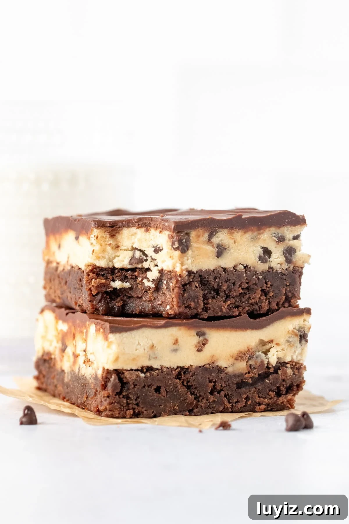 Cookie Dough Brownies Recipe: Chewy Brownies with Edible Cookie Dough Topping 8 Two cookie dough brownies on top of one another, with a bite taken out of the top brownie