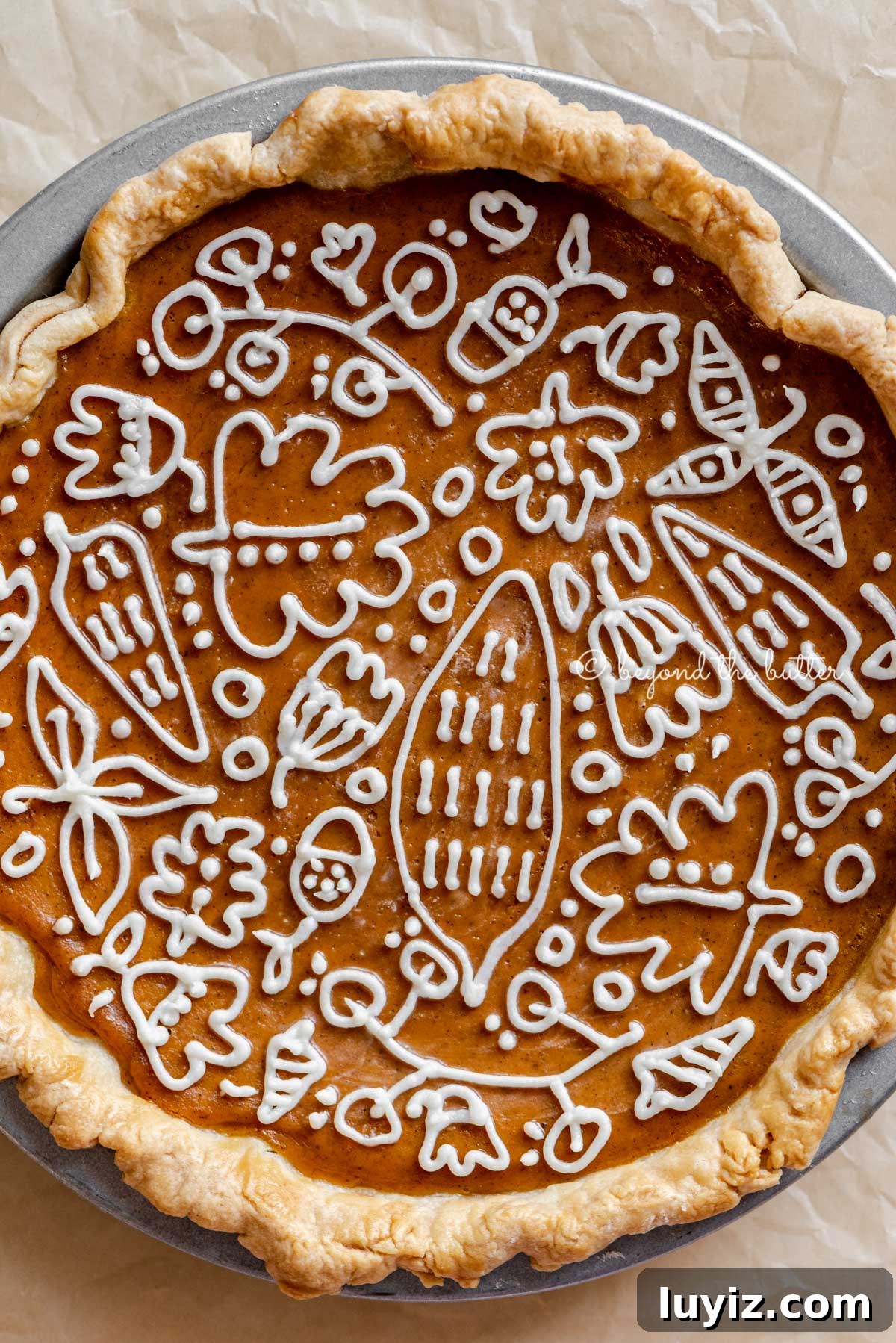 Perfect Pumpkin Pie Recipe for Creamy, Flaky Crust 7 Overhead close up image of perfect pumpkin pie with cream cheese frosting piped decorative top