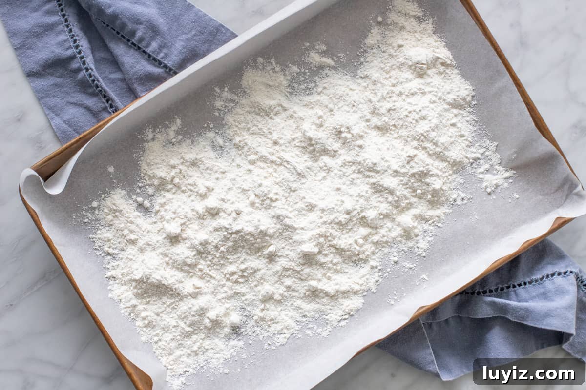 Edible Brownie Batter Recipe: Safe No-Bake Chocolate Batter 3 Flour on a lined cookie sheet